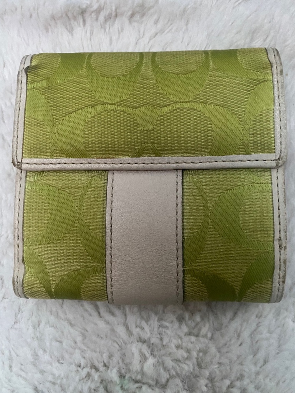 This is a vintage Coach lime green and cream jacquard wallet
